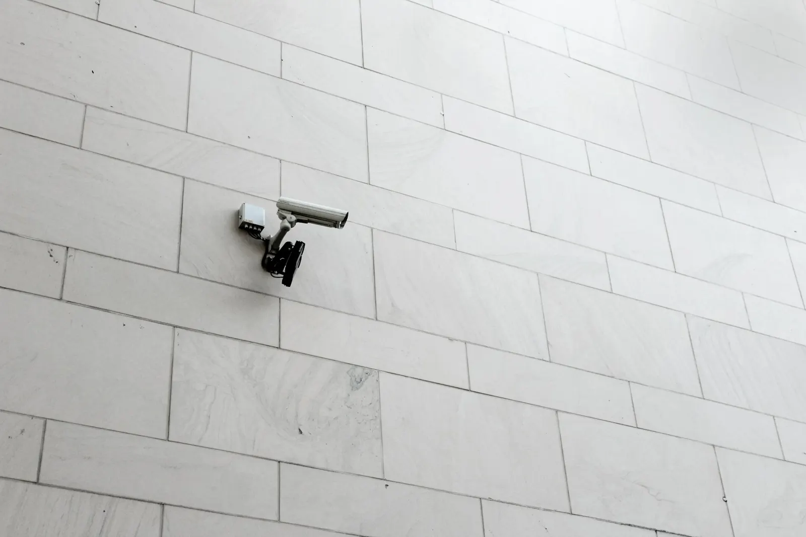 A security camera mounted on a wall
